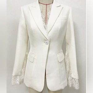 Lace jacket as shown in picture. It will fit Size 8.